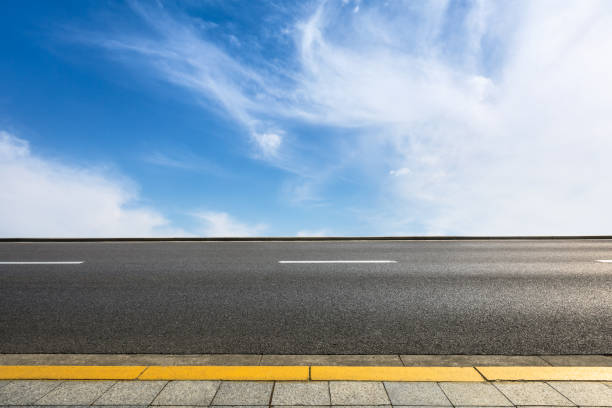 istock new asphalt road and sky clouds 958607652