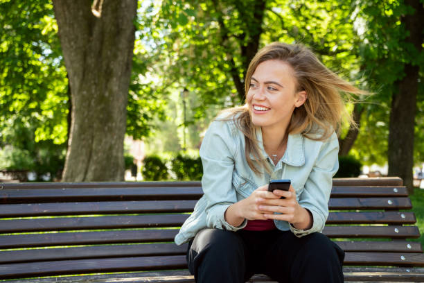 istock Young girl texting on a smart phone 958607686