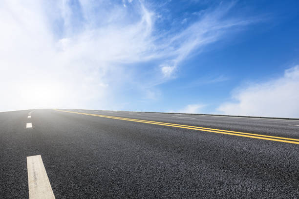 istock new asphalt road and sky clouds 958607772
