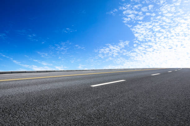 istock new asphalt road and sky clouds 958608150