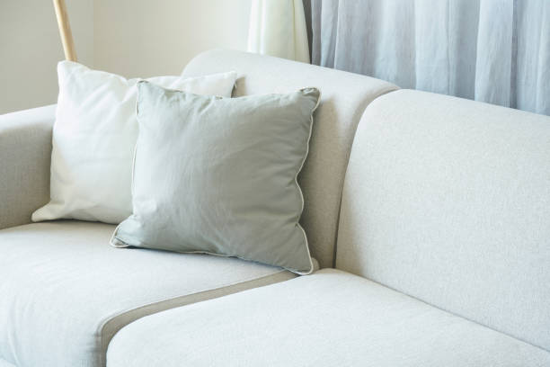 istock Light gray sofa with pillows in the living room 958616004