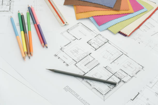 istock Architectural drawing with sample of material on working desk 958616052