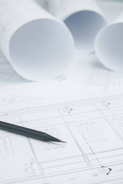 istock black pencil on architectural drawing paper and rolls for construction 958618010