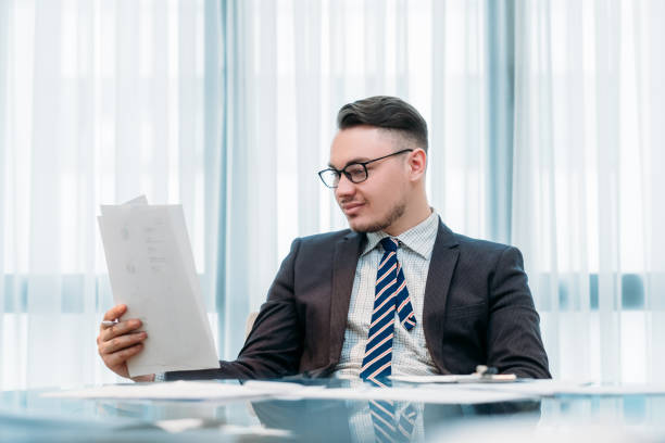 istock successful business man working office papers 958630066