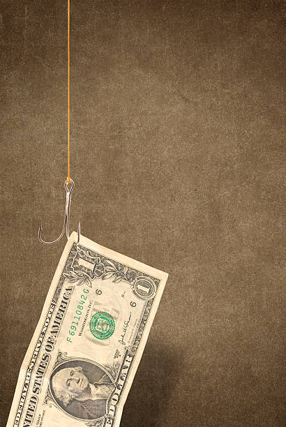 istock One dollar bill hooked on a fishing hook 95863064