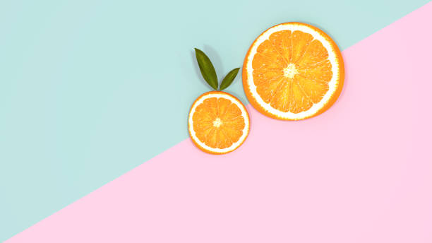 istock Orange slices concept on pink and green background for copy space minimal summer pastel colorful 958633656