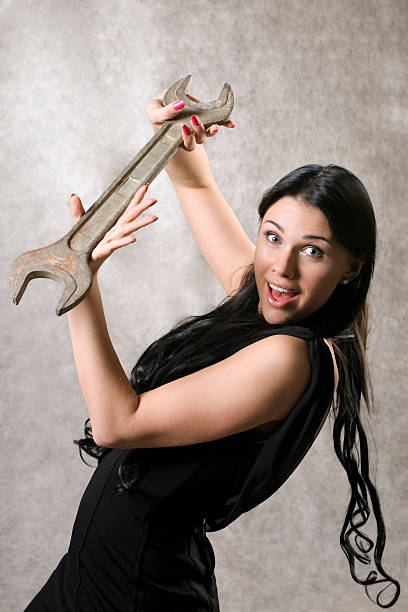 istock The elegant woman with a spanner 95863483