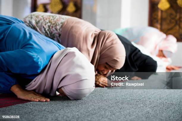 Muslim Women Praying In The Mosque During Ramadan Stock Photo - Download Image Now - Islam, Praying, Women