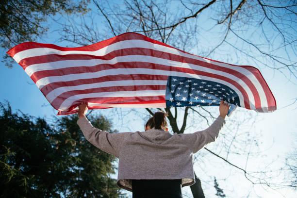 istock Young female athlete with American flag 958639168