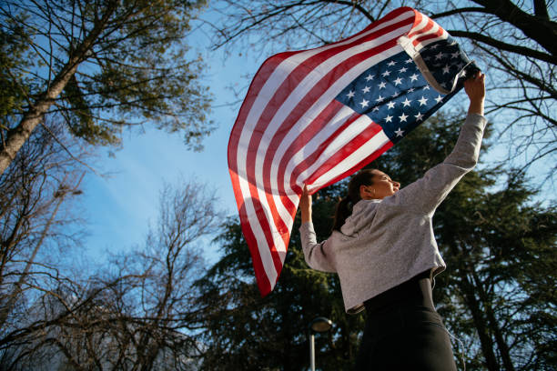 istock Young female athlete with American flag 958639426