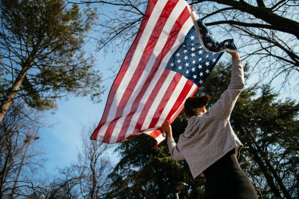 istock Young female athlete with American flag 958639702