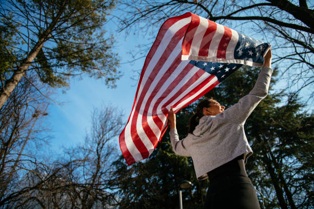 istock Young female athlete with American flag 958640026