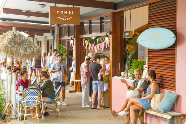 Byron Bay, Australia Byron Bay, Australia - May 6, 2018: People outsite cafes enjoying a sunny day in Byron Bay downtown. byron bay stock pictures, royalty-free photos & images