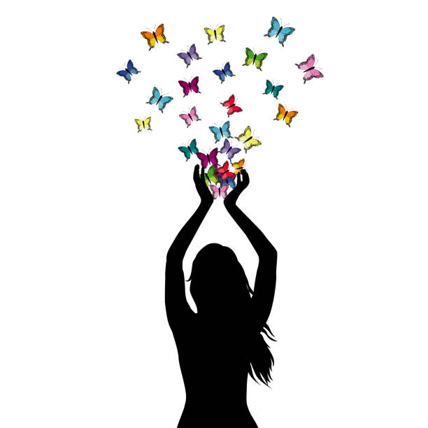 istock Abstract illustration of a woman silhouette with butterflies flying from her hands 958642946