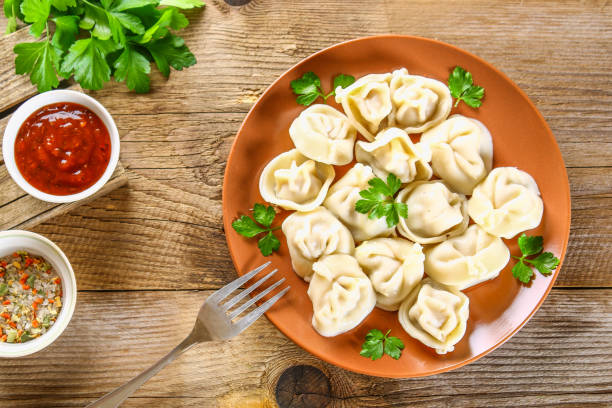 istock Homemade ready dumplings on an old wooden table. 958643104