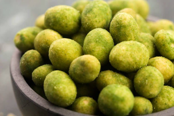 Pile of wasabi coated peanuts in bowl
