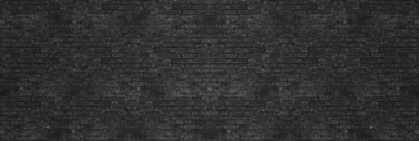 istock Vintage Black wash brick wall texture for design. Panoramic background for your text or image 958652514