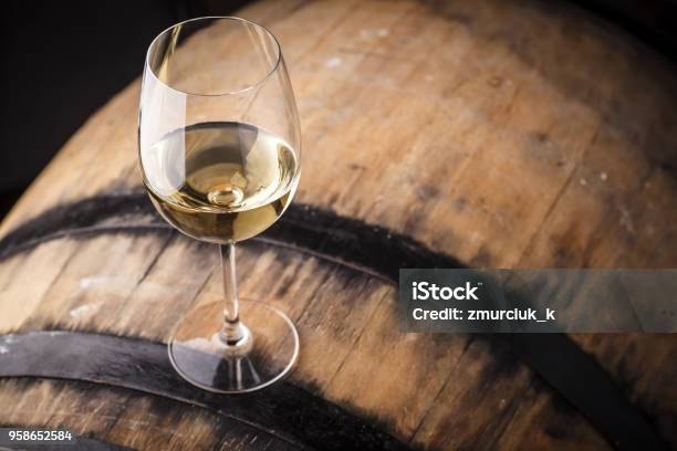 White Wine On A Barrel Stock Photo - Download Image Now - White Wine, Barrel, Drinking Glass
