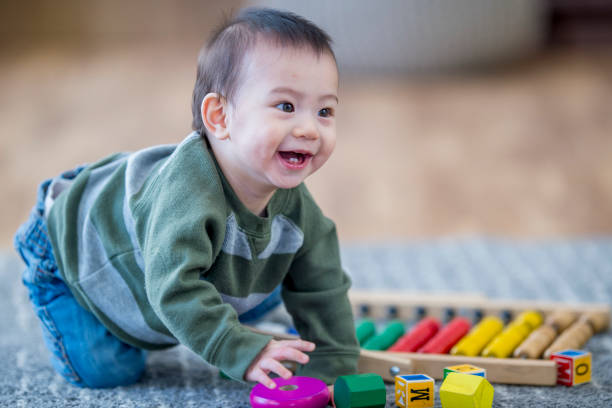 istock Happy Boy Playing With Toys 958653106