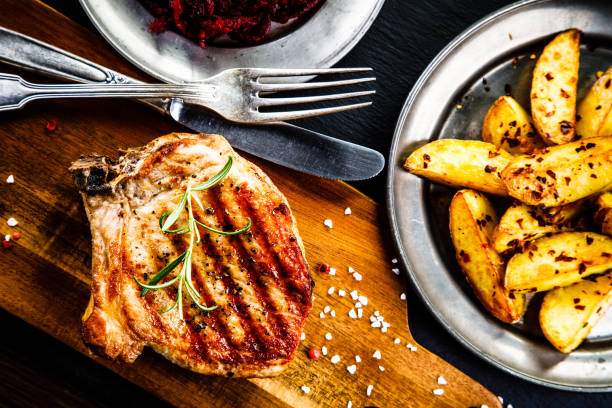 istock Grilled pork chop and vegetables 958657964