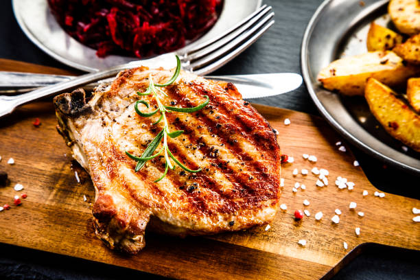 istock Grilled pork chop and vegetables 958658008