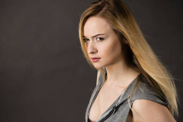 istock Beautiful woman having serious face expression 958658694