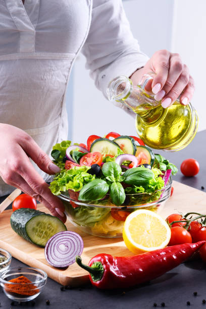 istock Preparation of a vegetable salad from fresh organic ingredients 958662898