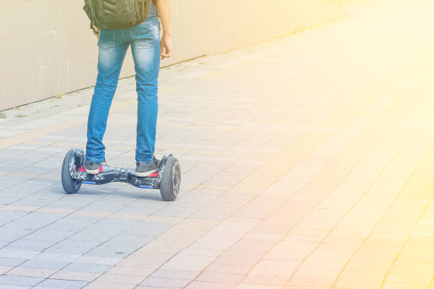 istock A young guy moves along the sidewalk on a gyroscope 958663006