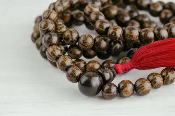 Old wood mala beads, traditionally used in prayer and meditation. Essential accessory for mindfulness or practice yoga.