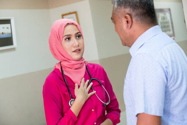 istock Asian female doctor has a discussion with her patient 958664176