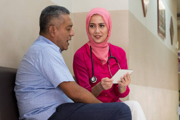 istock Doctor shows her patient the test results 958664304