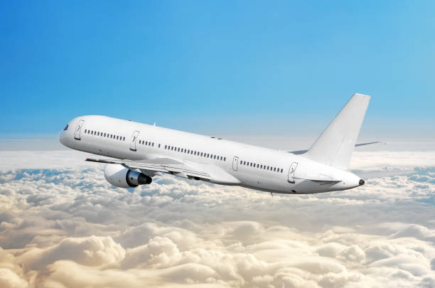 istock Passenger airplane fly on a hight above overcast clouds and blue sky. 958666830