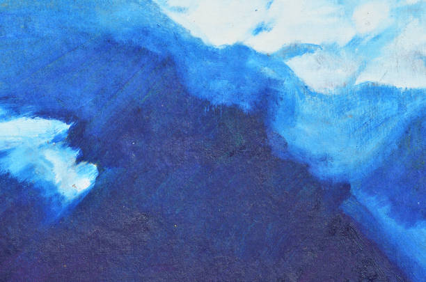 istock White watercolor blobs of paint on canvas, painted over in blue 958671682