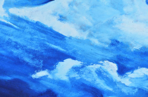 istock A blue sky with white clouds is painted with watercolor paint on canvas 958672004