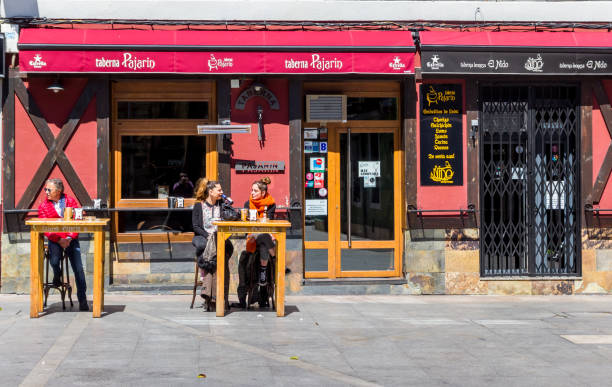 Leon, Spain - April 16, 2018: People having a drink at a cafe in Leon, Spain