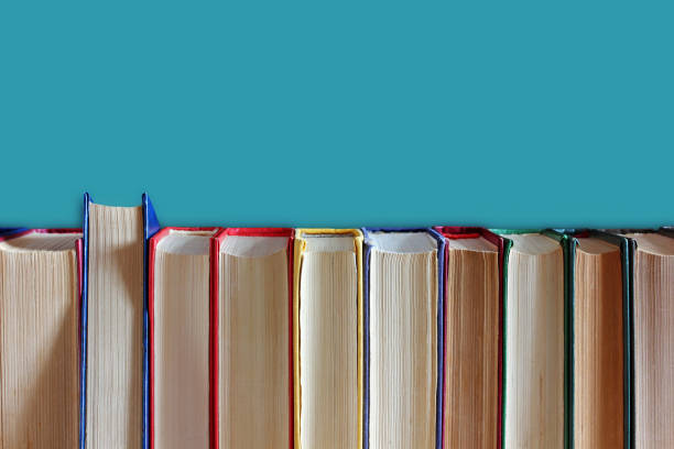 istock Books in hardcover on a blue background. 958672122