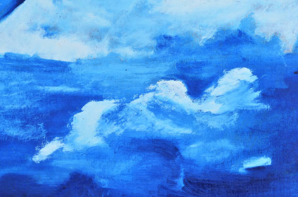 istock White clouds on canvas painted in blue 958673240