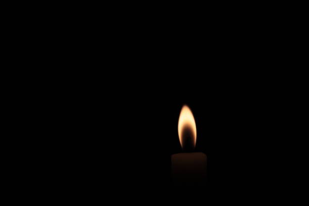 istock Candle Flame On A Black Background Photo Shot. 958678424