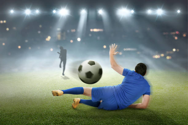 istock Goalkeeper try to catch the ball 958679324