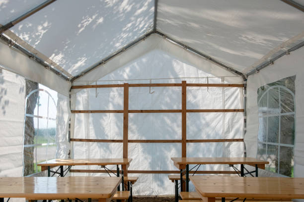 istock Small party tent with tables and chairs - indoors 958681860