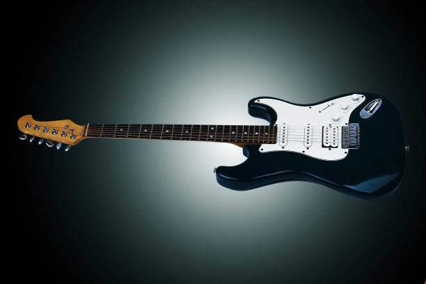 istock Beautiful guitar. Isolated on a black background 958682916