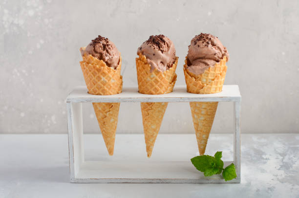 istock Chocolate ice cream with chocolate crumbs on gray concrete background. 958686758