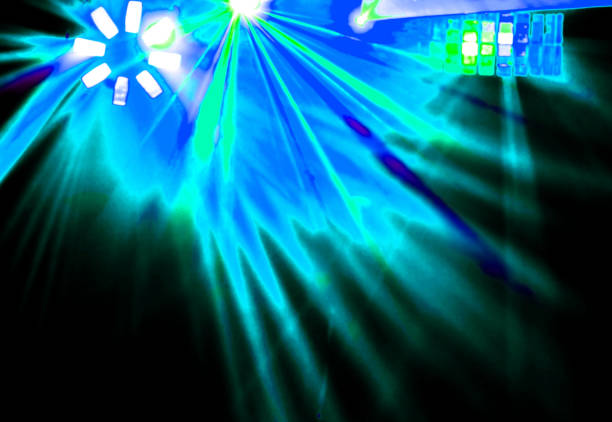 istock Lighting disco with bright beams of searchlight and laser show 958687090