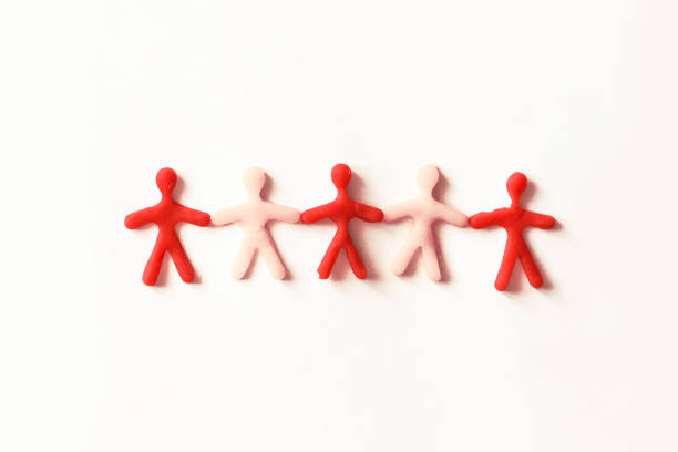 istock silhouettes - people of dough on a light background 958687408