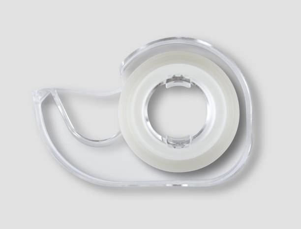 istock Scotch tape dispenser isolated on grey background 958687426