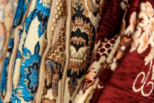 istock Many colorful carpets for sale on fair 958687548