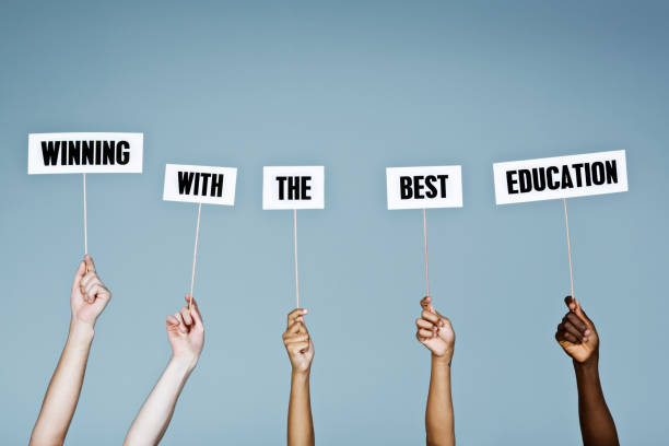 istock Hands hold aloft sign