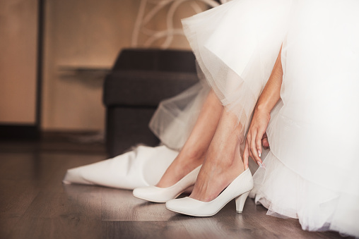 Woman bride dress white shoes in her wedding day