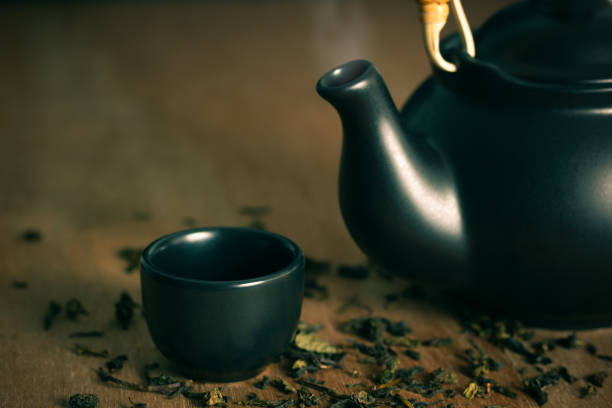 istock Glass and ceramic teapot with hot smoke. 958697646