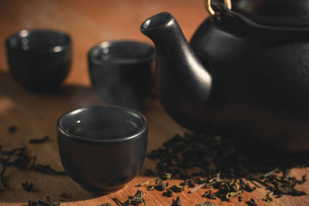 istock Glass and ceramic teapot with hot smoke. 958697650